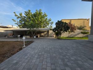 Spacious backyard with covered parking area of a luxury villa in Jumeirah 3 Dubai