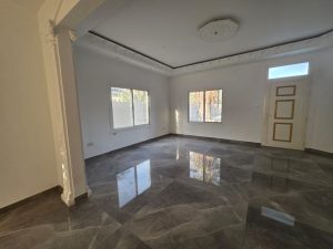 Luxury living room with marble flooring and natural light in a villa in Jumeirah 3 Dubai