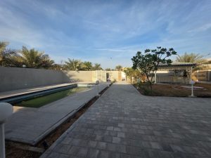 Private swimming pool and landscaped backyard of a luxury villa in Jumeirah 3 Dubai