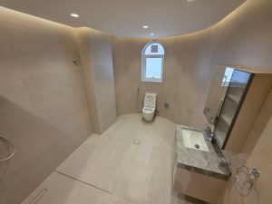 Spacious modern bathroom with walk-in shower and premium tiles in a renovated villa in Jumeirah 3 Dubai