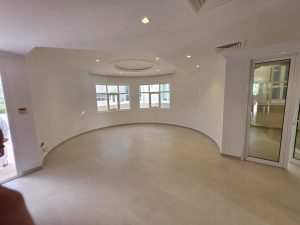 Spacious living room in a fully renovated villa in Jumeirah 3 Dubai with curved design and natural light