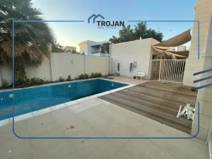 Private swimming pool with wooden deck in a 5 bedroom villa for rent in Al Barsha, Dubai