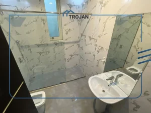 Guest bathroom in a 5 bedroom villa for rent in Al Barsha with modern finishes and glass shower