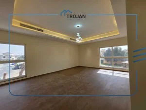 Spacious master bedroom with wooden flooring and large windows in stand-alone 5 bedroom villa for rent in Al Quoz 2 Dubai