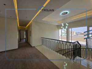 Upper floor hallway with staircase and modern lighting in stand-alone 5 bedroom villa for rent in Al Quoz 2 Dubai